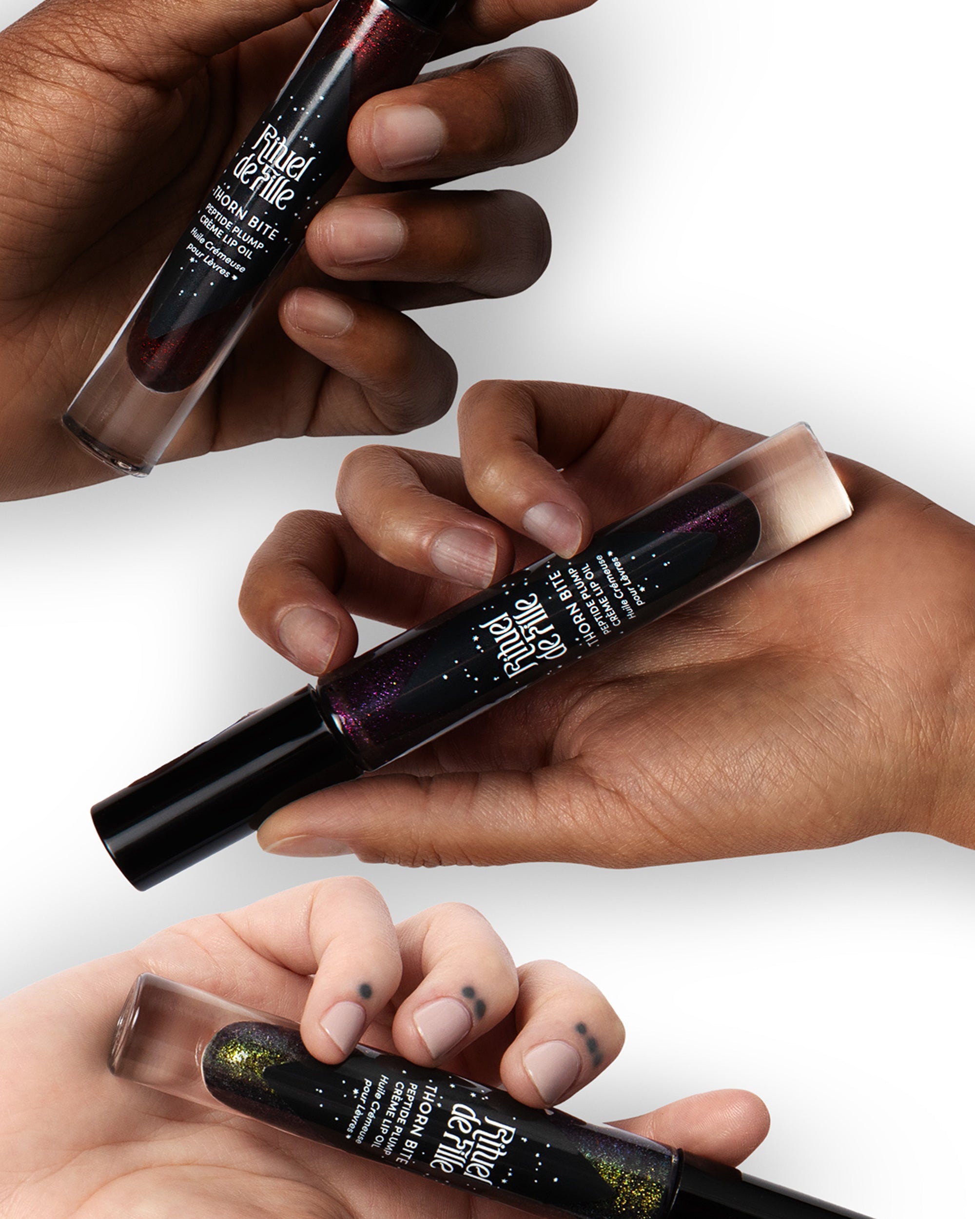 Three tubes of Chroma Obscura Thorn Bite lip oil 