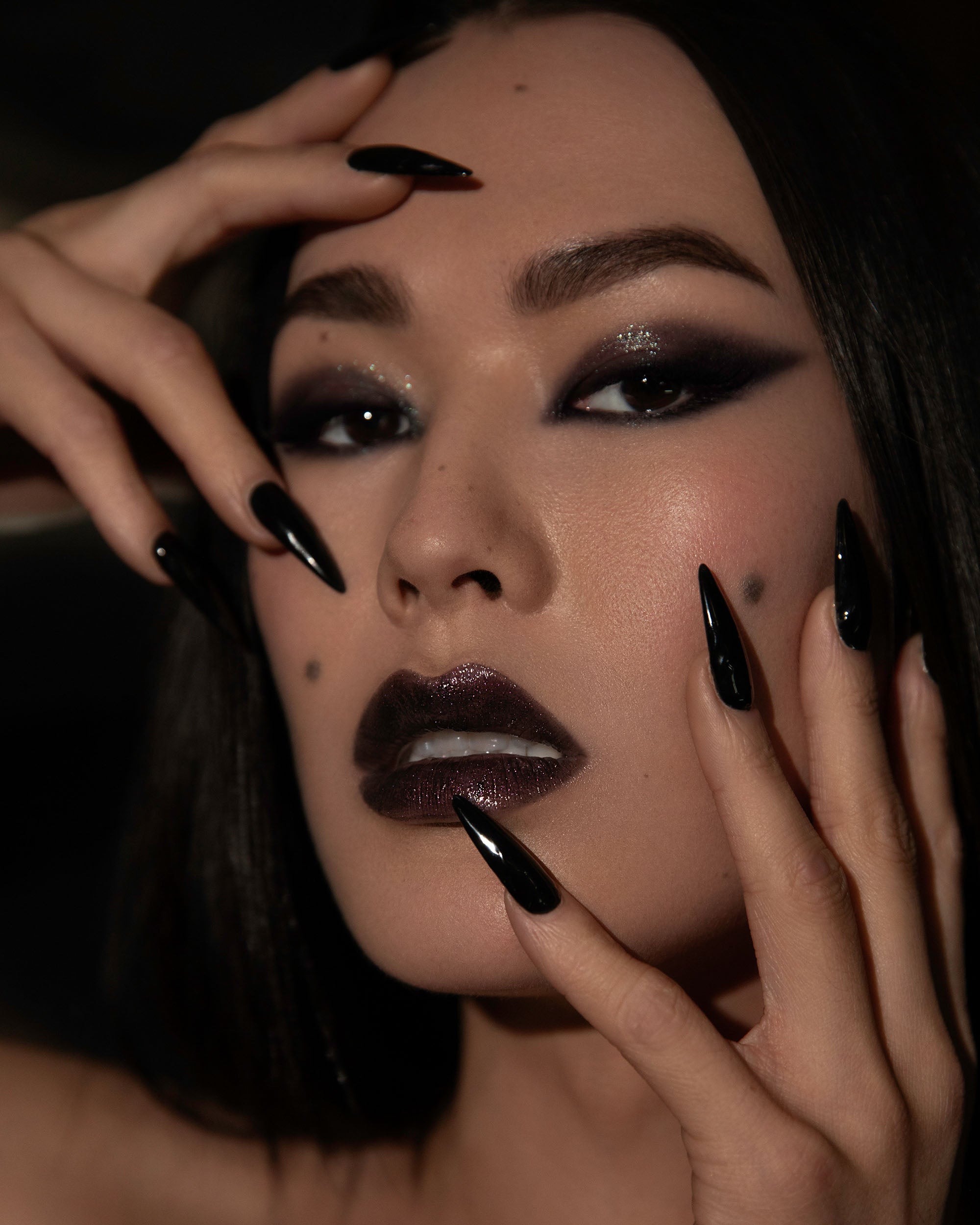 Campaign image featuring model wearing Night Bloom lip oil