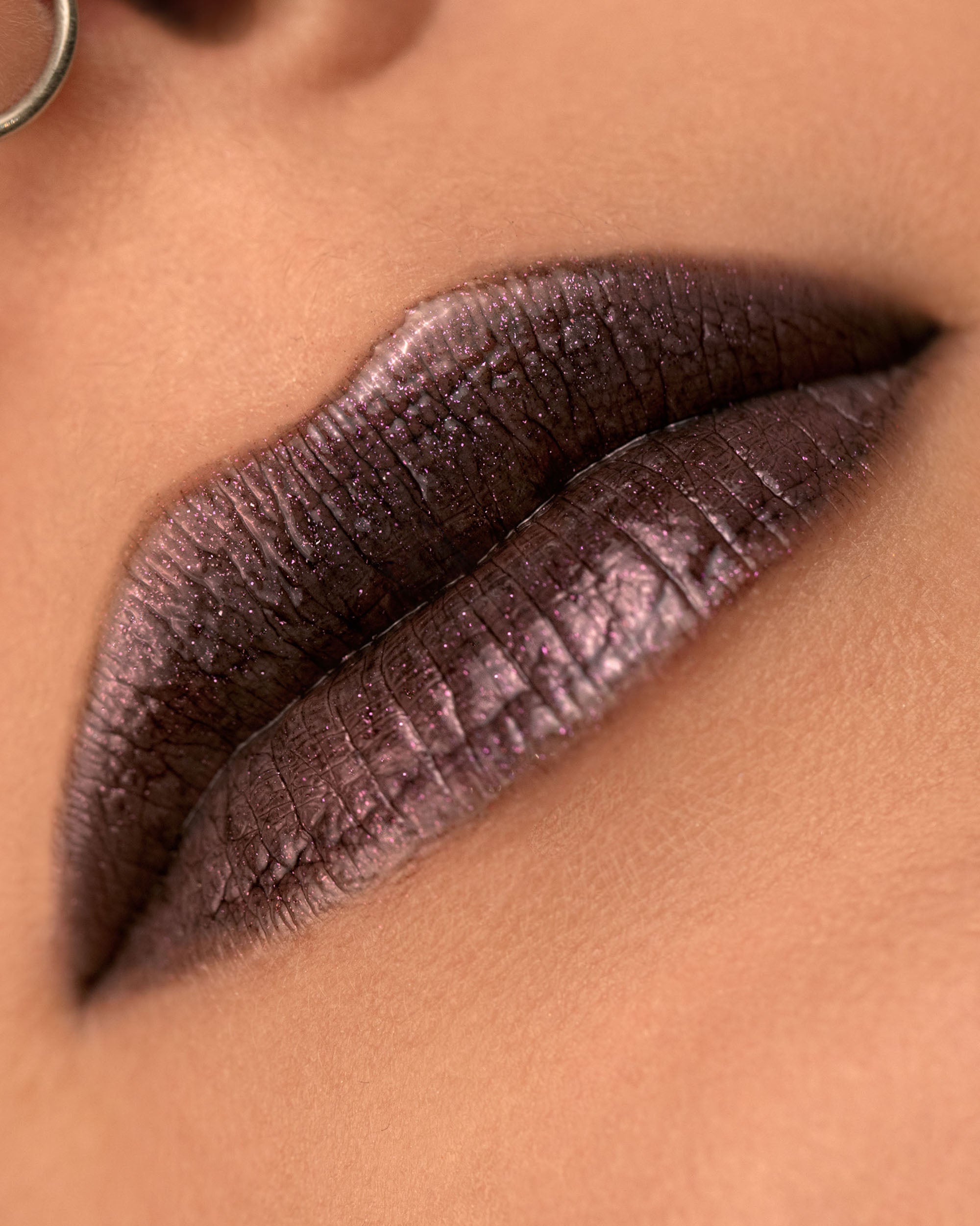 Close-up lip macro of Night Bloom Thorn Bite lip oil