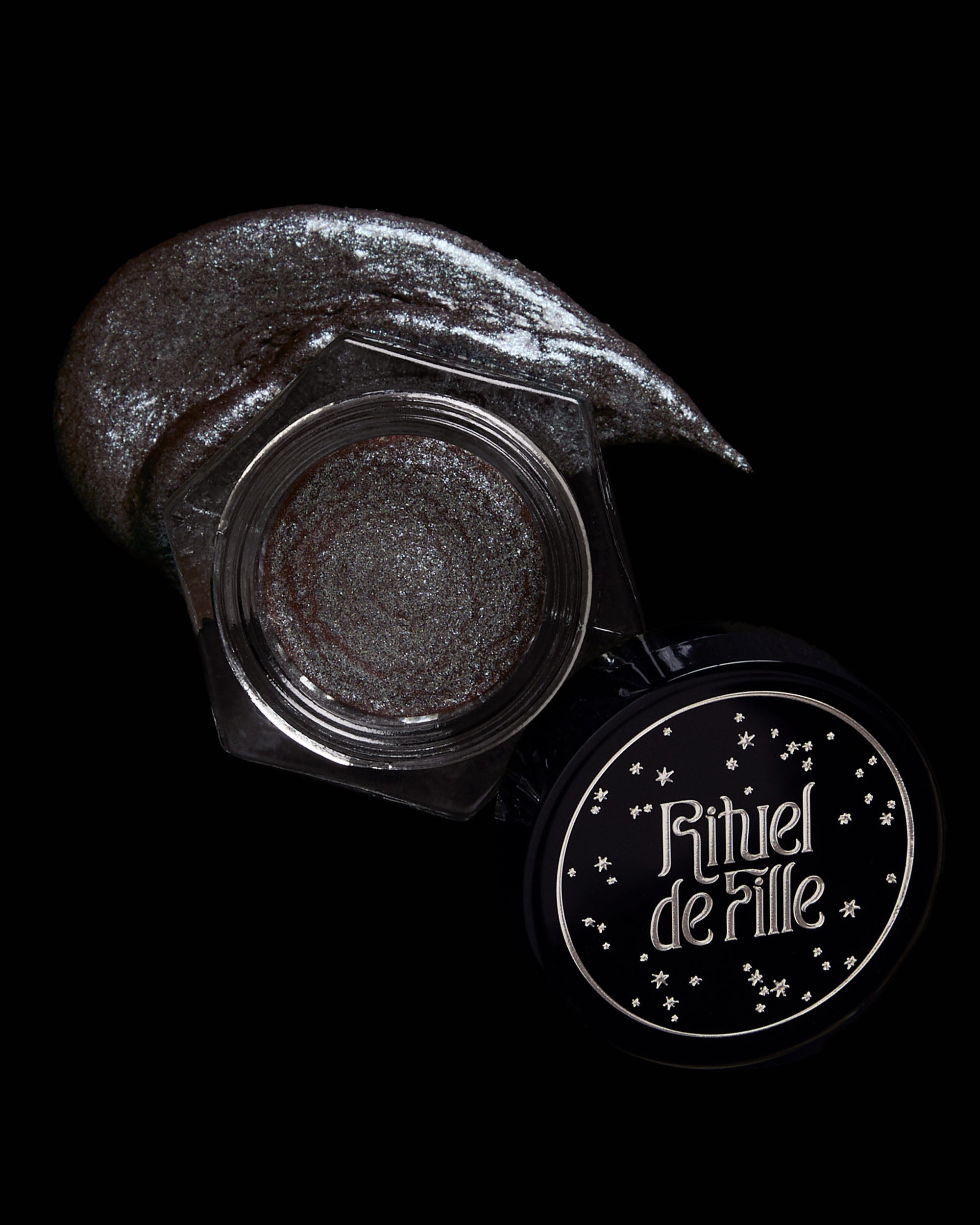 Makeup product with 'Rituel de Fille' branding on a black background